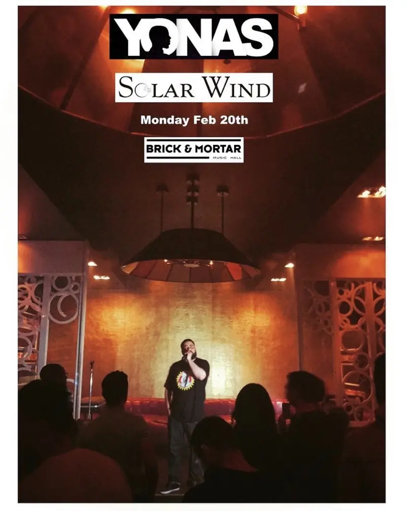 Show flyer: Yonas with Solar Wind, Monday Feb 20th, Brick and Mortar, over a stage shot of MC Solar Wind performing